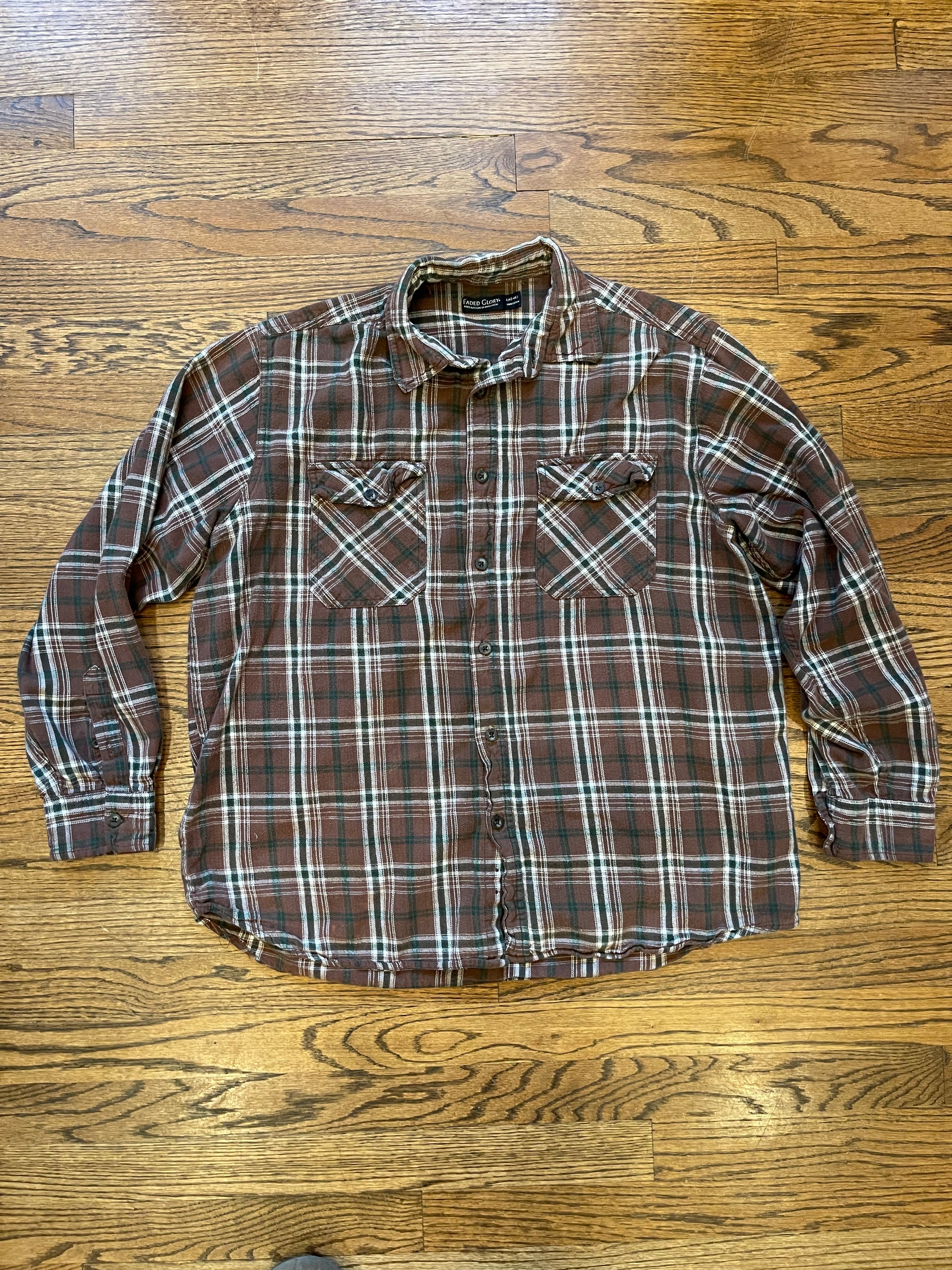 Plaid shirt on a wooden floor