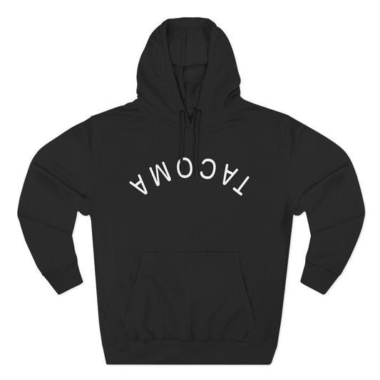 Front view of black hoodie with flipped Tacoma print in white lettering
