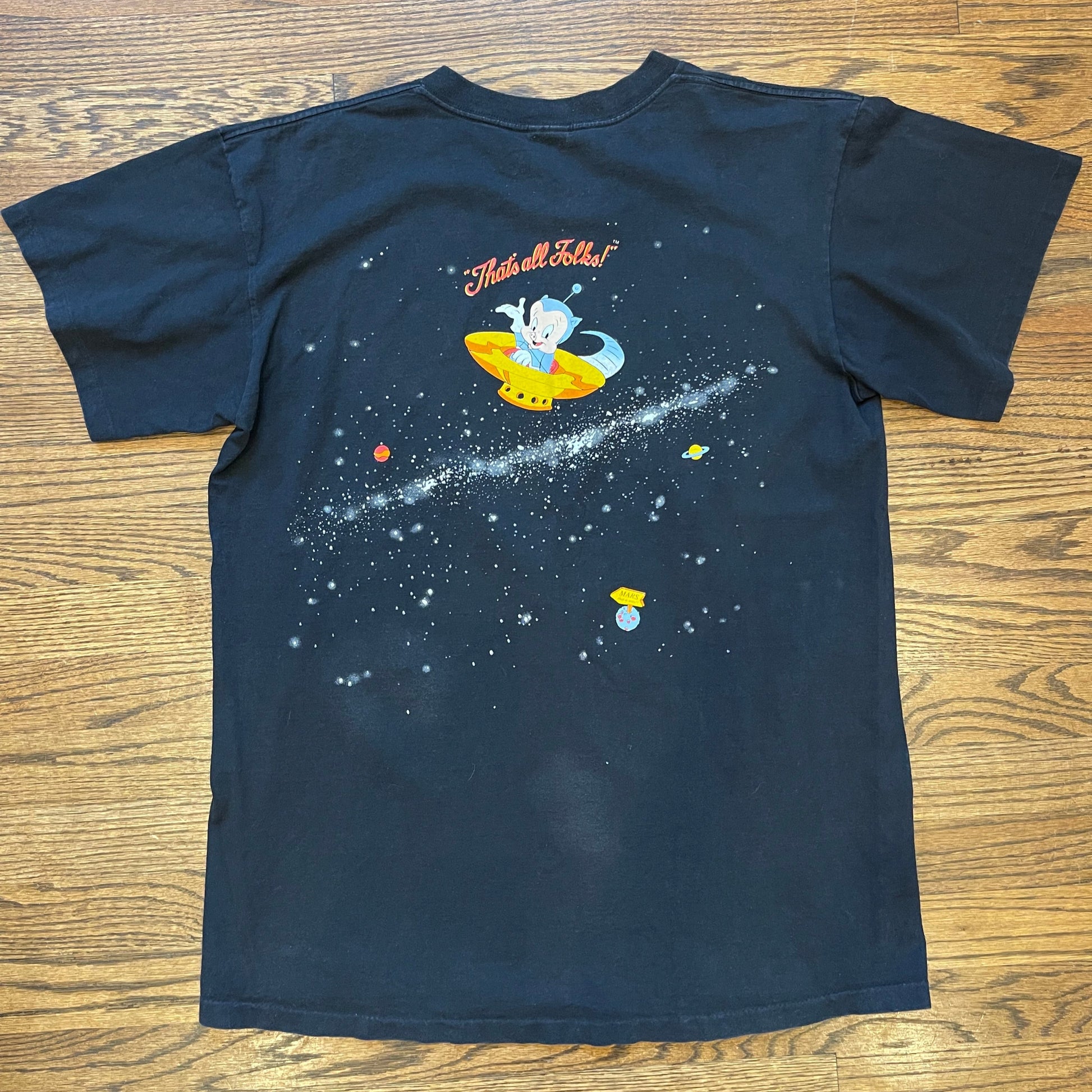 Back of vintage 90s tee with Porky Pig spaceship and “That’s All Folks!”