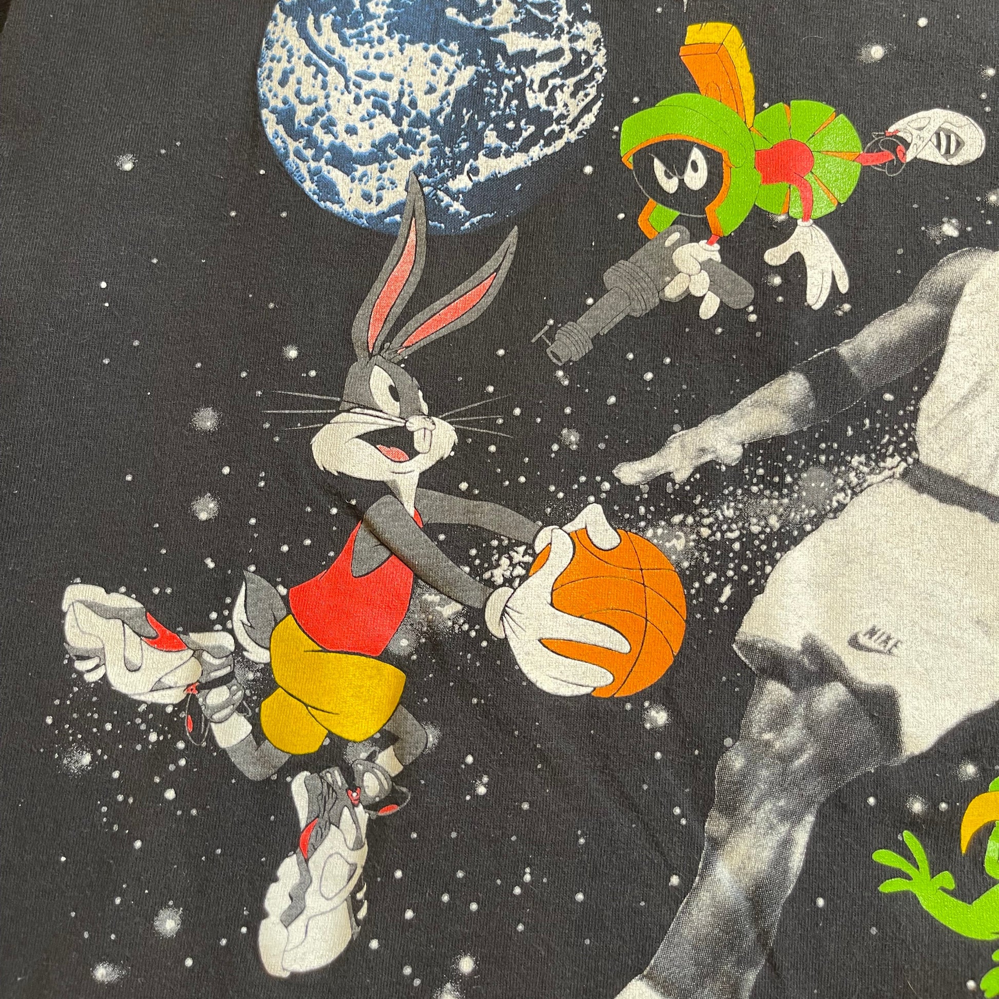Collage of cartoon characters including Bugs Bunny and a basketball player with Earth in space.